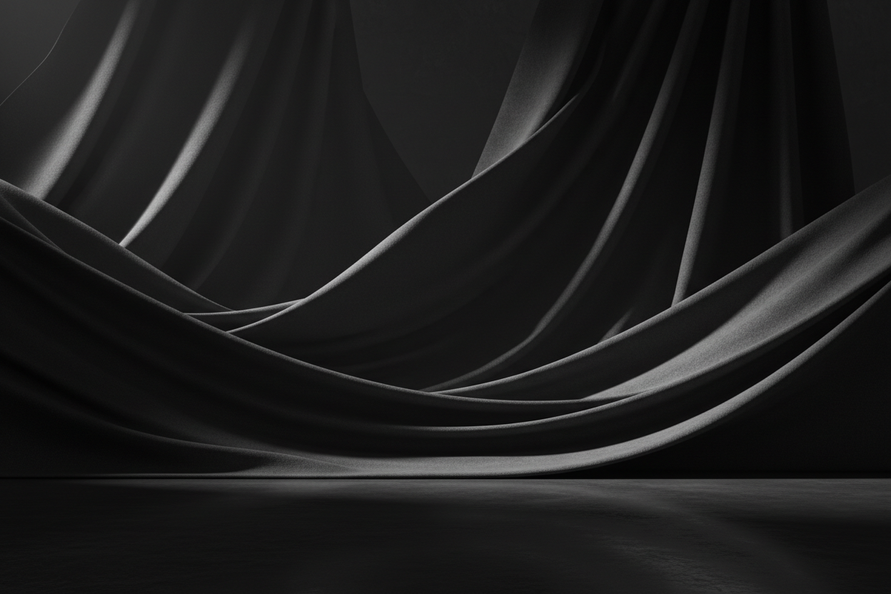 Ultra-minimalist high-end fashion background, deep black and charcoal tones, cinematic lighting with soft shadows on premium fabric textures, mysterious and sophisticated atmosphere, 8k resolution, no people, no clutter